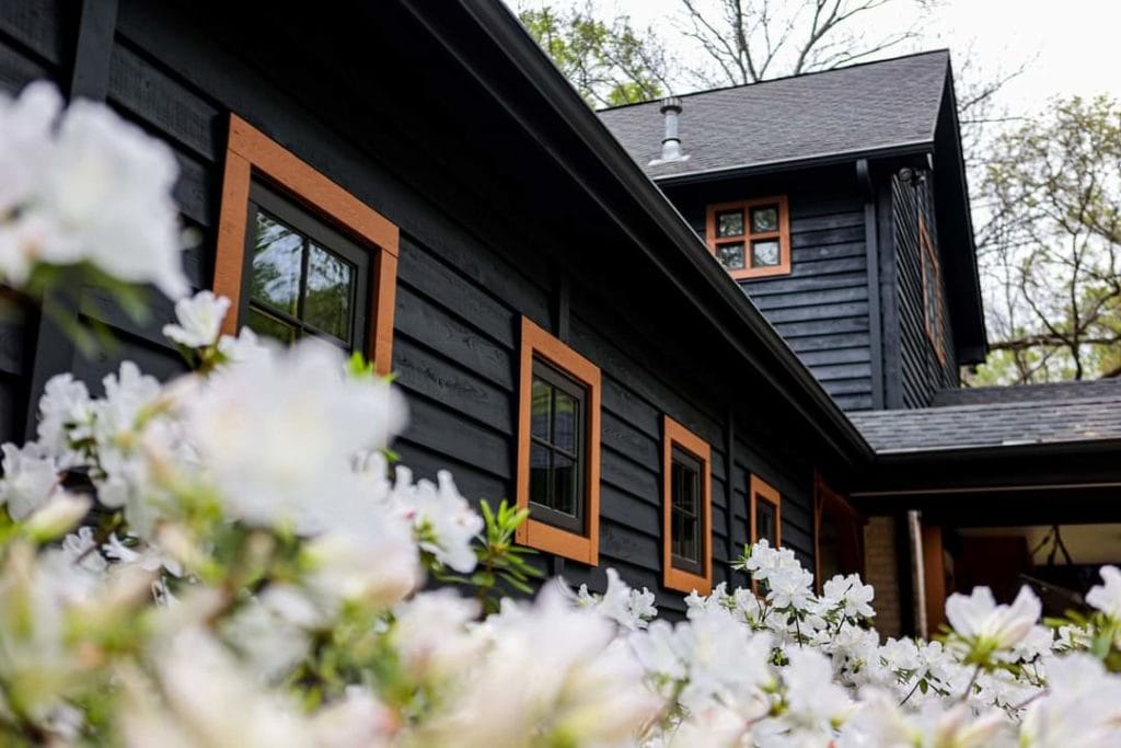 exterior cedar siding stained with benjamin Moore woodluxe in a solid dark stain done local house painting service