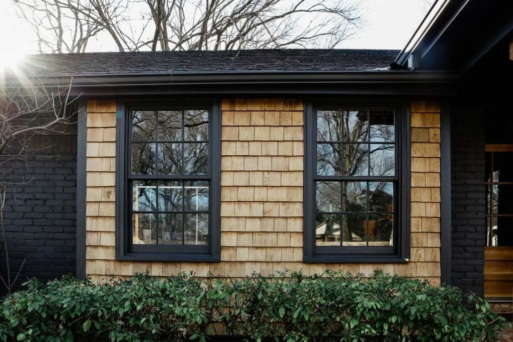 cedar siding stained with clear general finishes exterior 450 with Benjamin moore Wrought Iron 2124-10 BM with black windows and trim