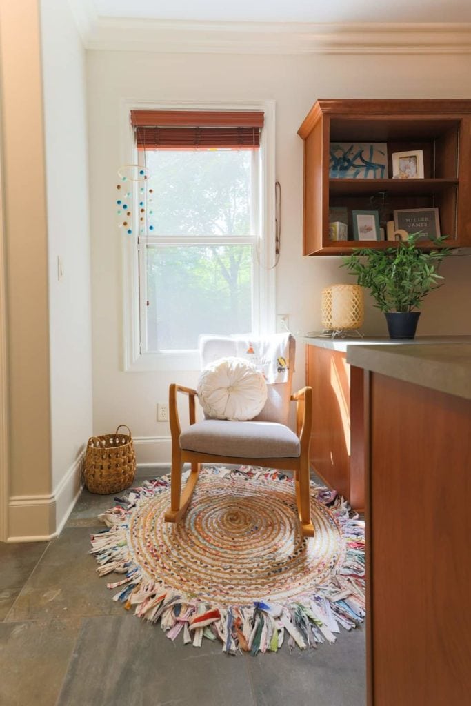 picture of a bedroom painted with Benjamin Moore Mountain Peak White OC-121 with a wood chair professional painting service