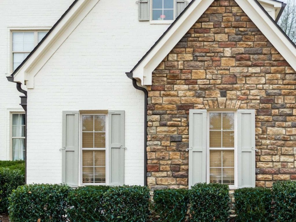 a local home exterior painted in Romabio masonry flat brick service