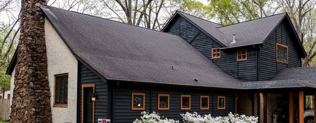 dark solid stain on cedar siding using Benjamin Moore woodluxe