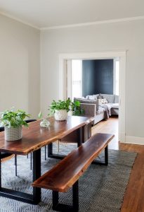 blue gray dinning room with wooden table