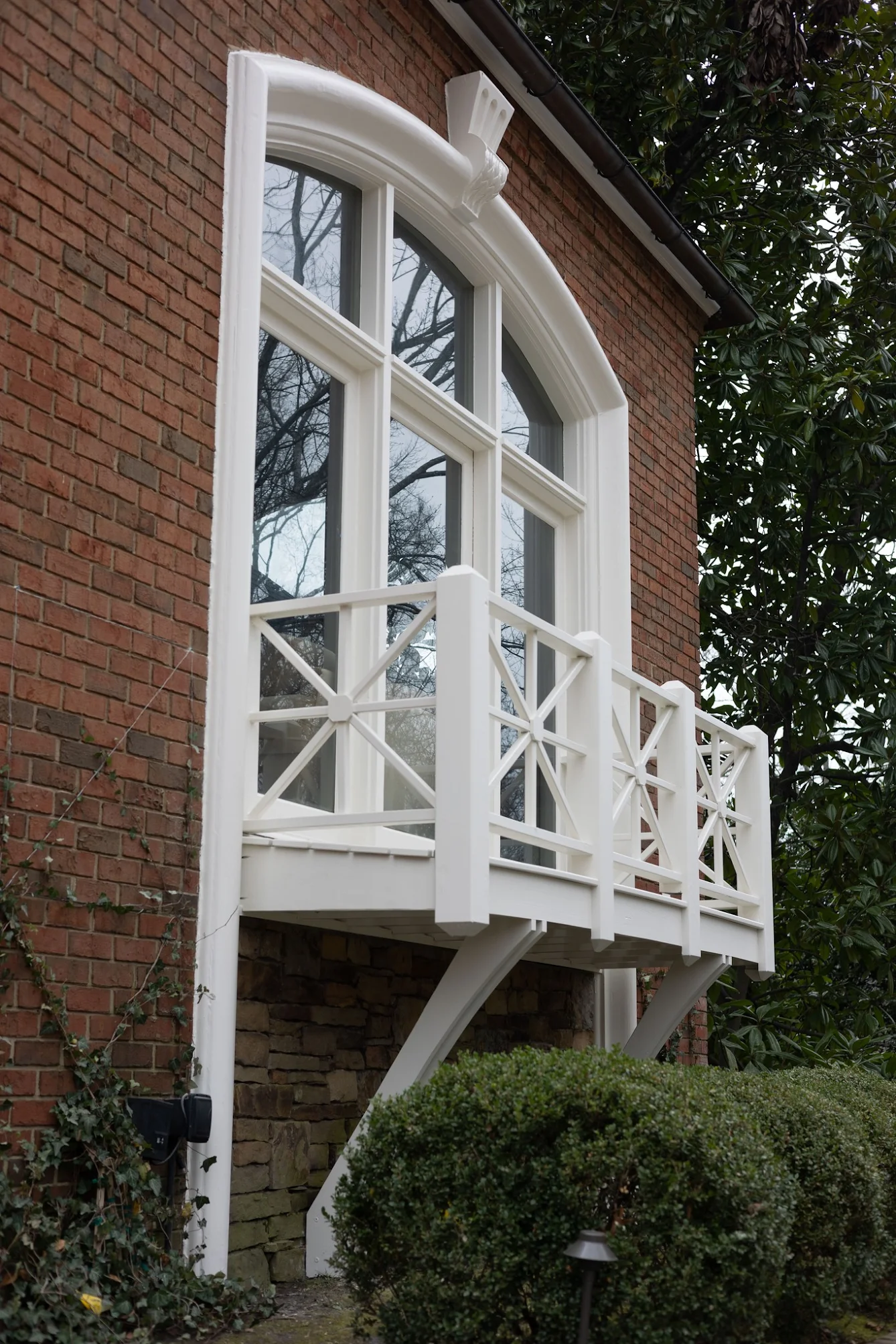 Front porch railing and wiindow in Benjamin Moore Feather Down