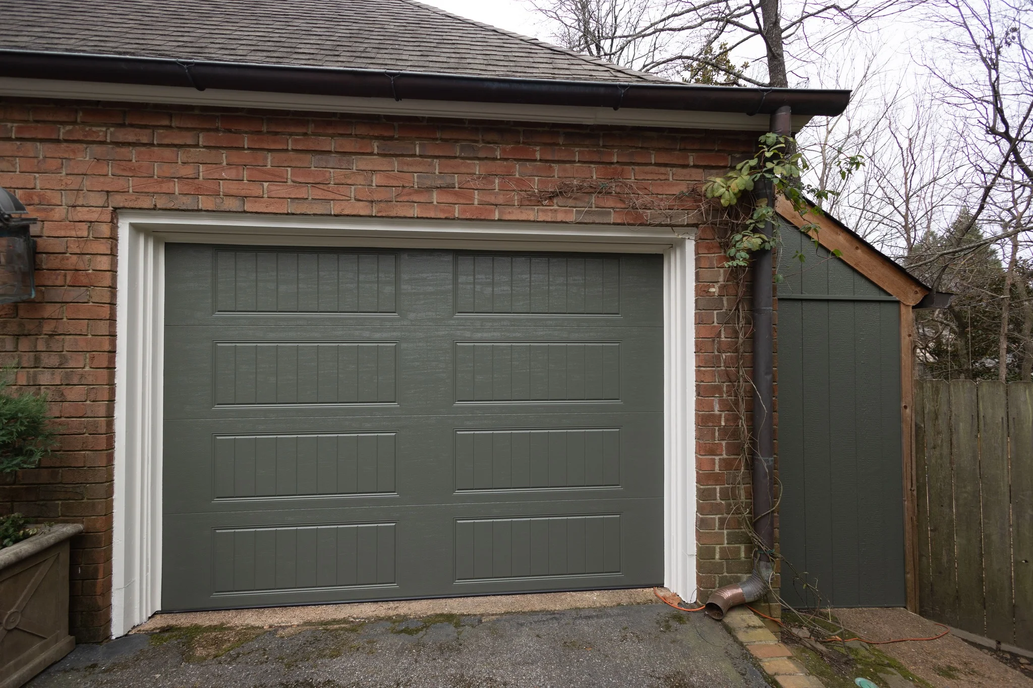 garage door painted with Benjamin Moore Dark Olive and garage door frame Feather down Benjamin Moore